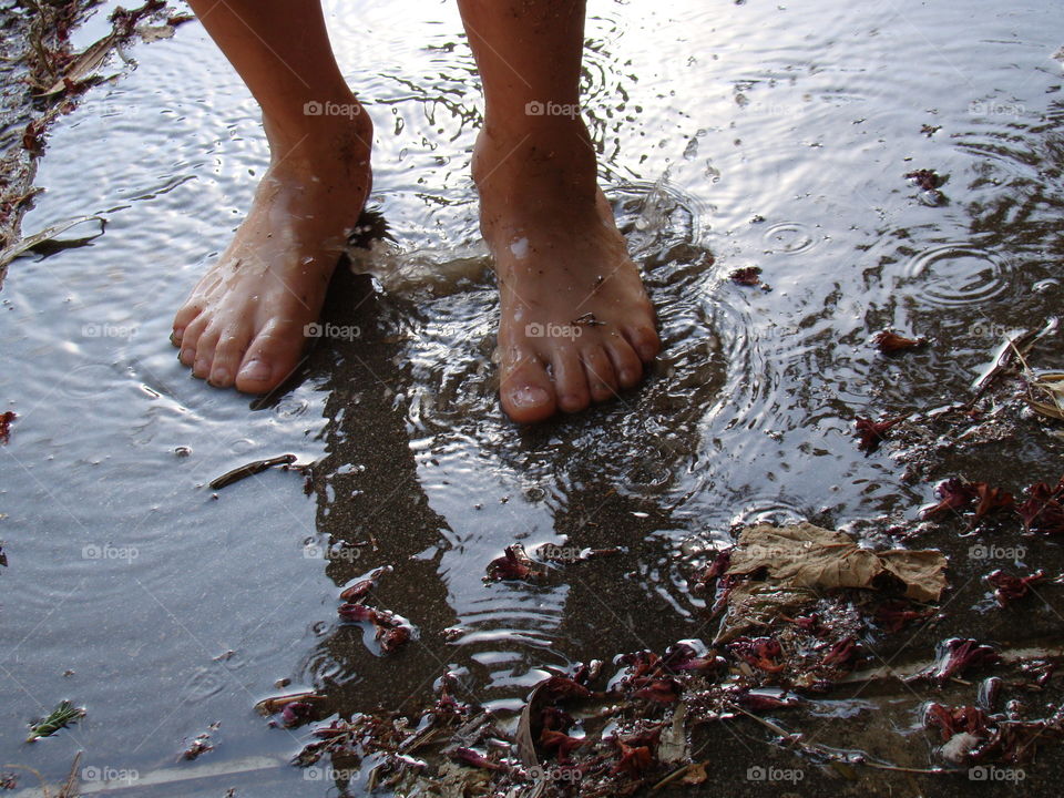 Feet in a puddle