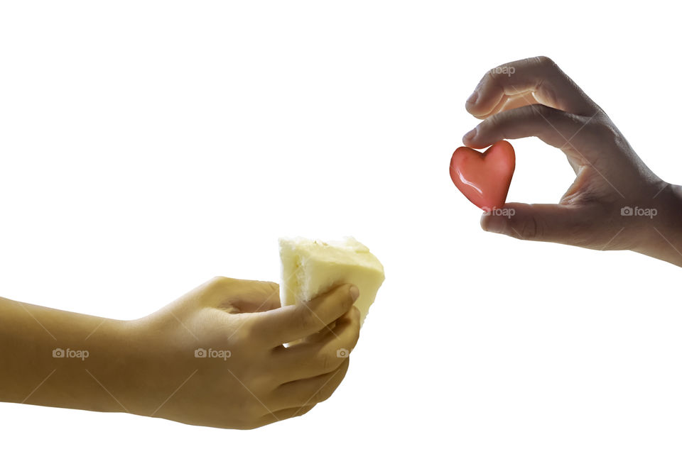 Isolated Hand boy holding the bread sandwich and holding a red candy shape heart on a white background.