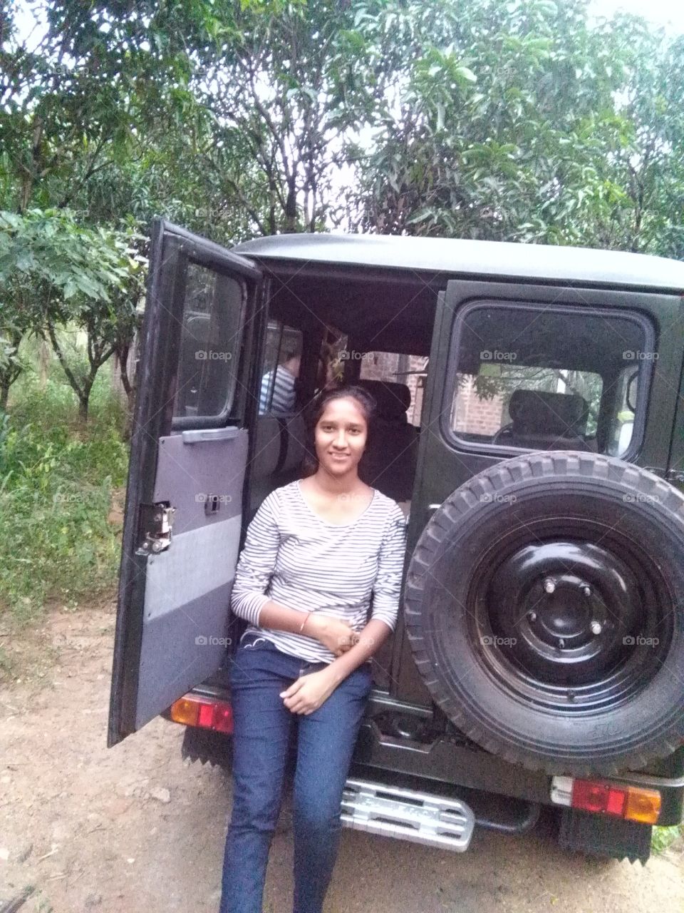 A girl in jeep
