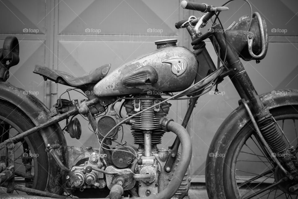 old vintage motorcycle NSU OSL 251 from 1951, black and white photo
