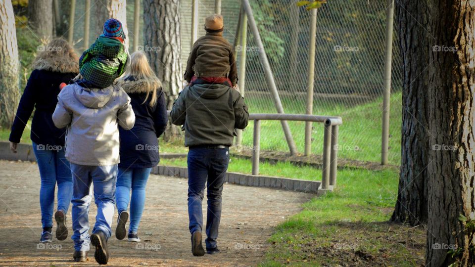 young families go for a walk with their children.