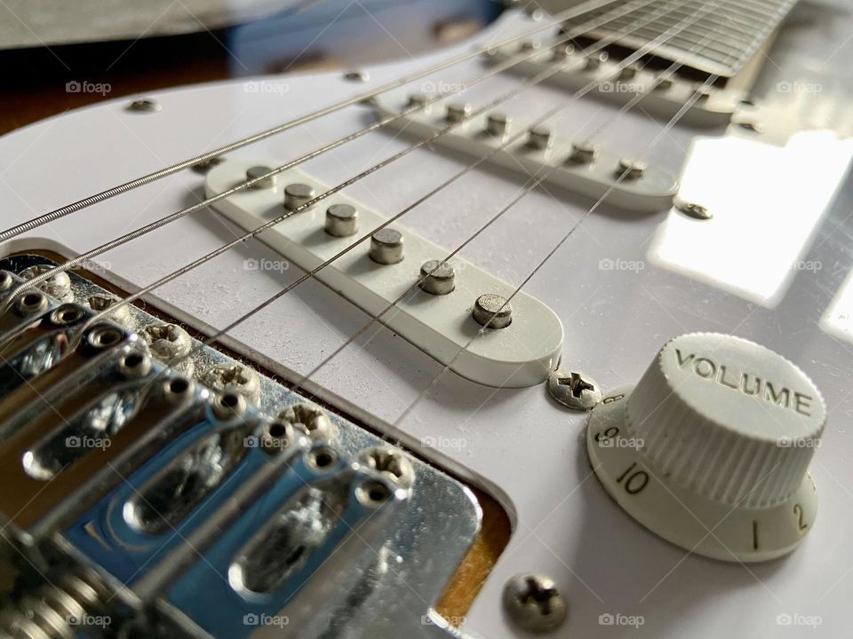 A vintage electric guitar seen from an unexpected angle
