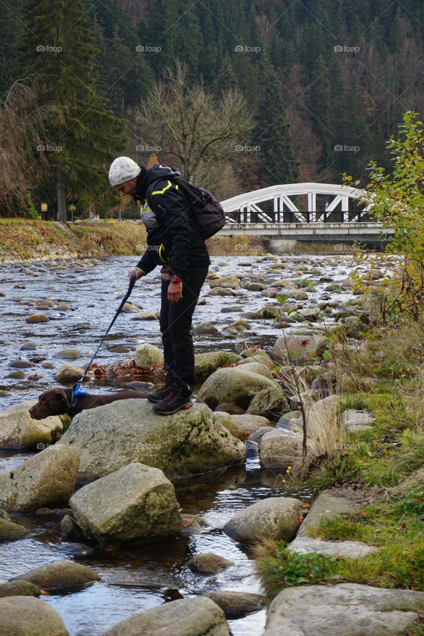 River#stones#human#dog