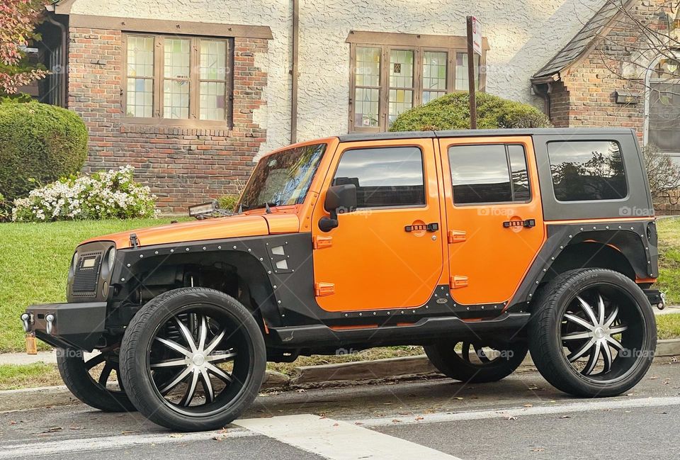 Automobile in the vibrant orange fall color. 