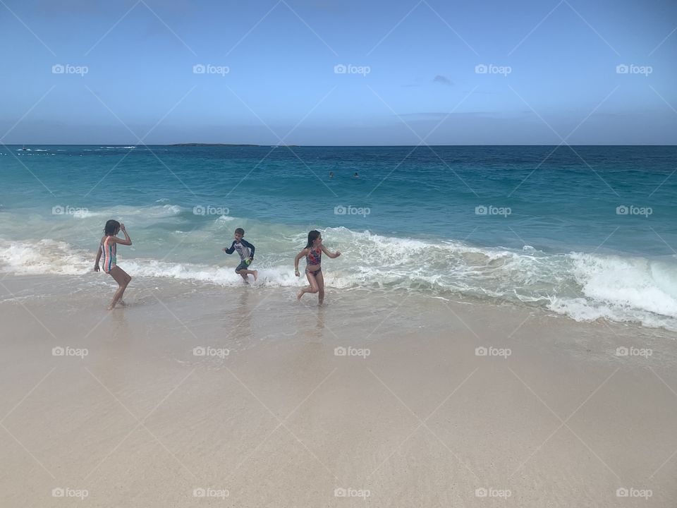 Kids playing in the ocean water