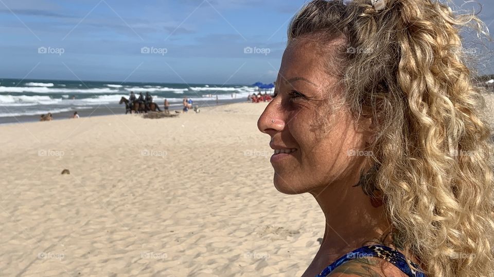 Profile woman against beach 