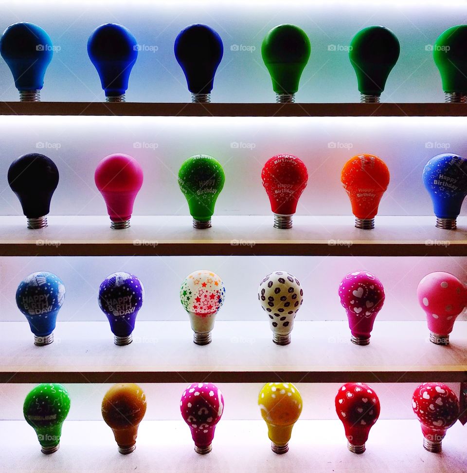 bulbs covered by balloons for display on the shelf