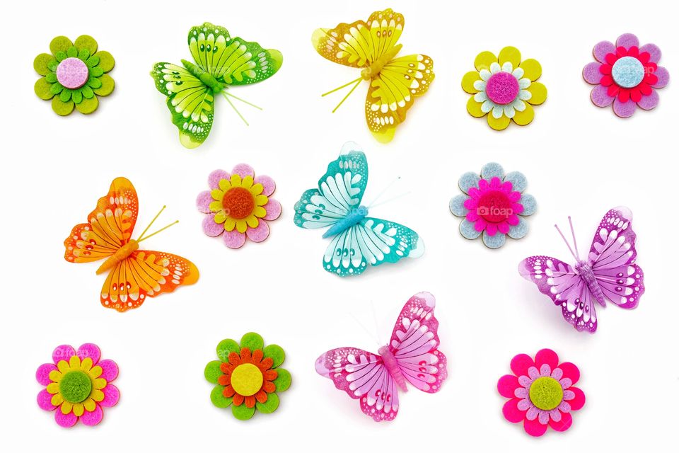 A background full of colourful butterflies and Spring flowers.