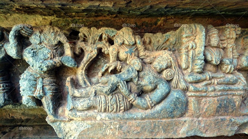 Halebeedu Hoysaleeswara temple - sculptures represents the story of baby krishna killing the demon boodhana - carved intricately in stone within 4-5 inches