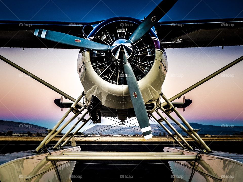 De Havilland  Beaver float plane aircraft at sunset.  