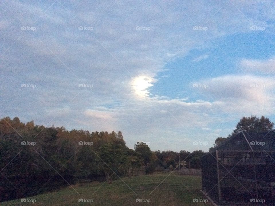 Playful clouds cover super moon 