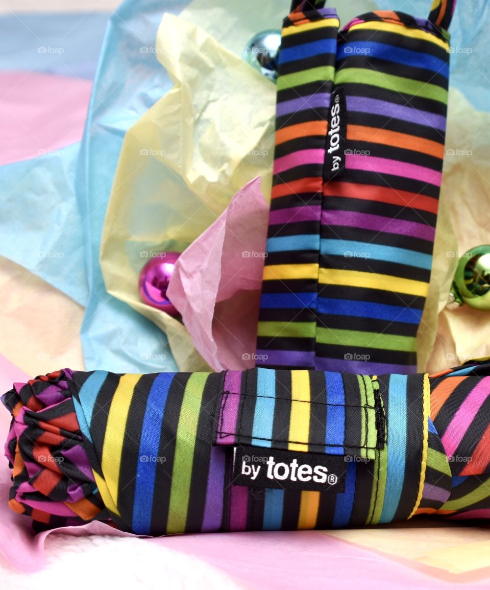 Totes striped umbrella in a Christmas themed flat lay still life 