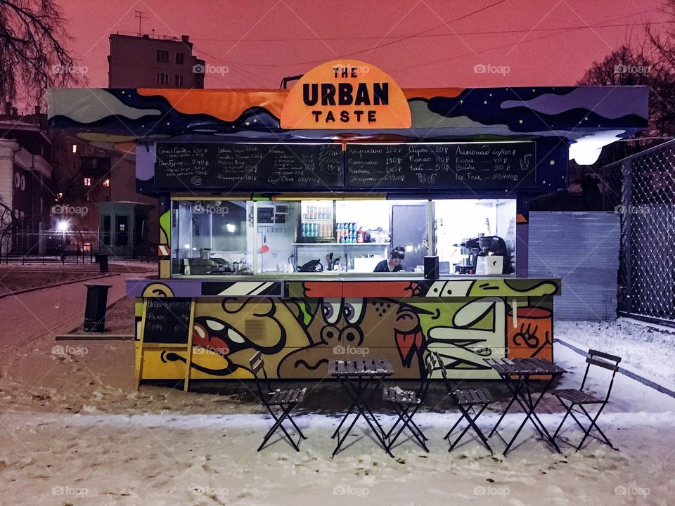 Lonely urban street food vehicle at winter night
