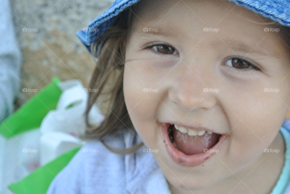 a happy kid eating chocolate cookies