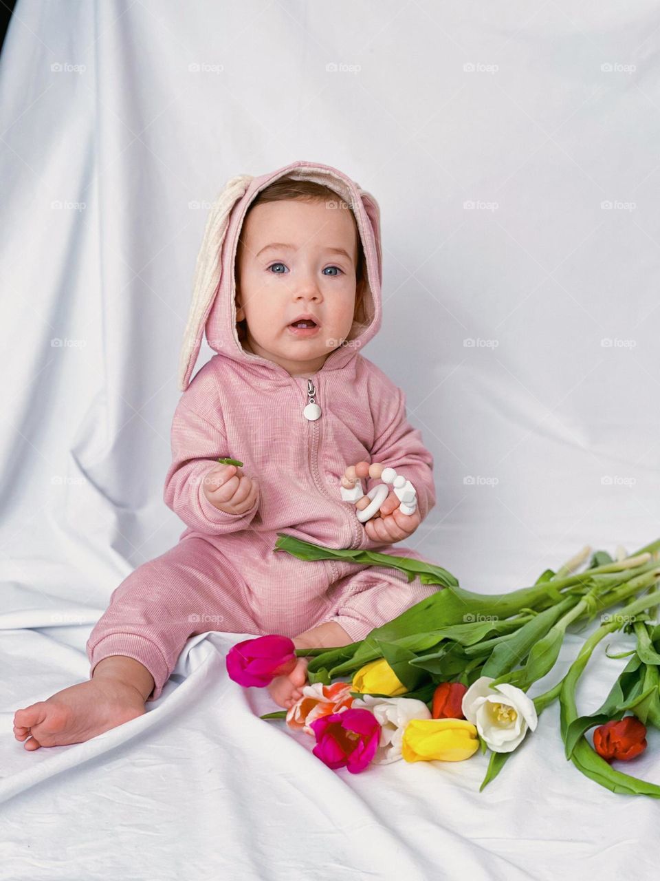 Spring time. Baby girl with flowers