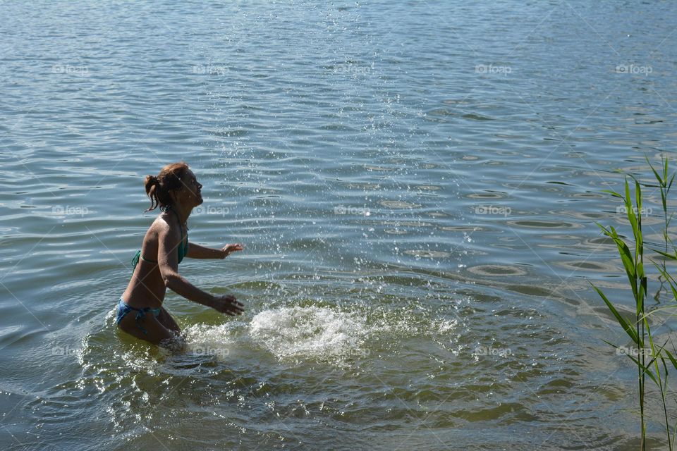 woman in water city lake