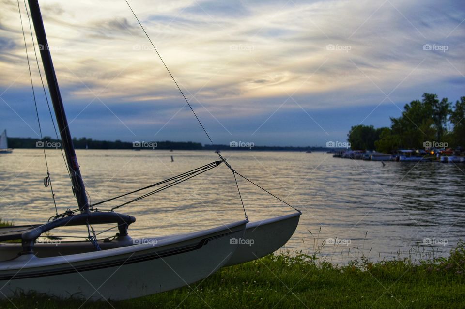 Evening on lake with sailboat in Indiana.