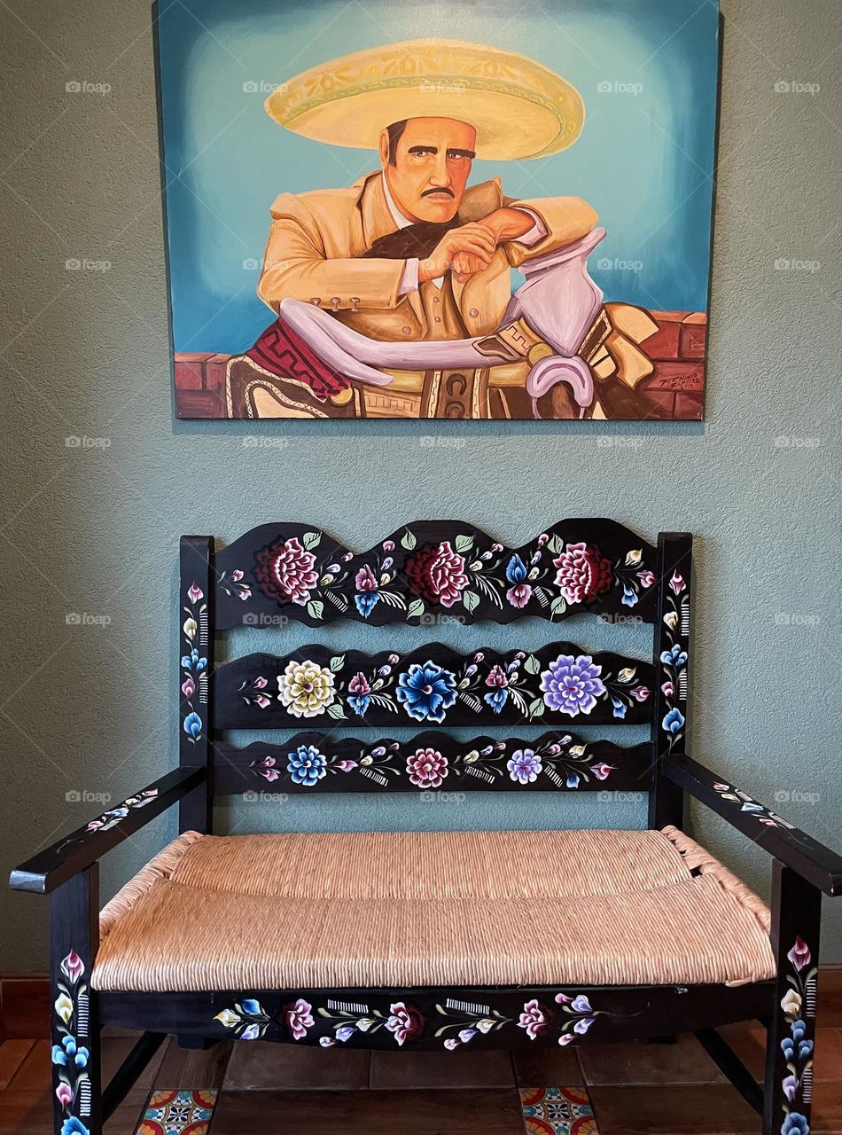 Mexican decor, large chair and painting in La Piñata, eating at Mexican restaurant, decorating Mexican restaurants, Mexican decor in a restaurant 