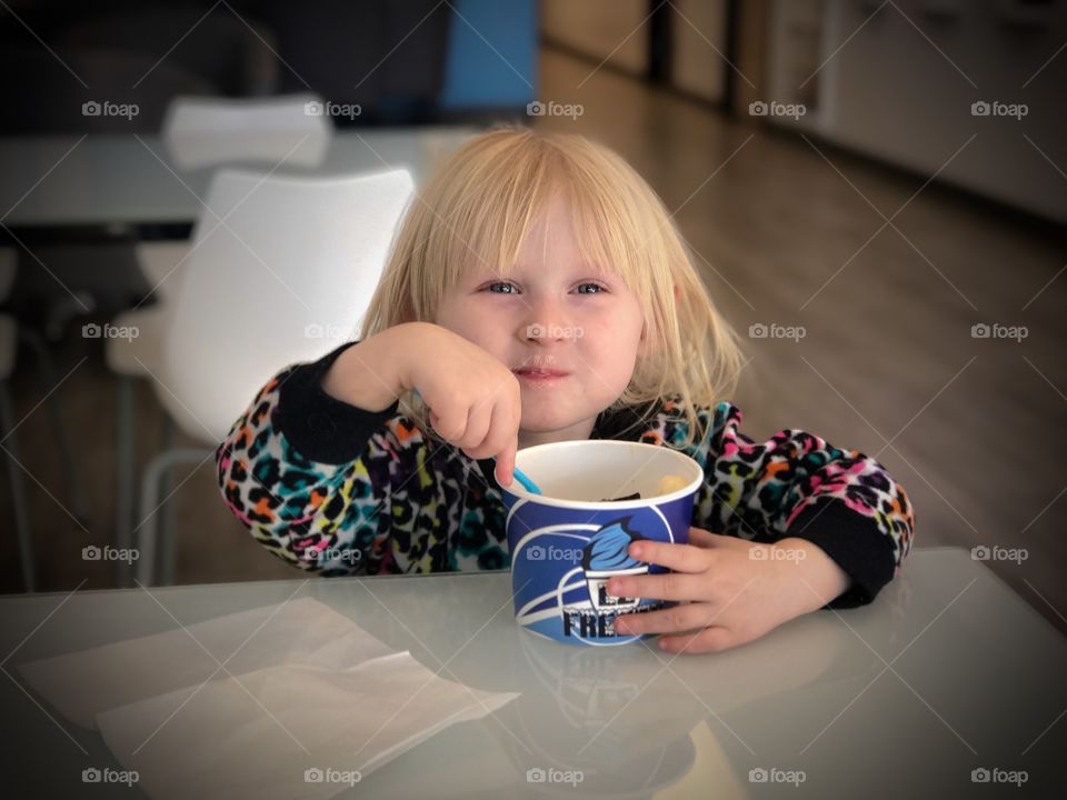 My daughter enjoying some ice cream. I thought this was a great time to take a picture. She was having a great time!