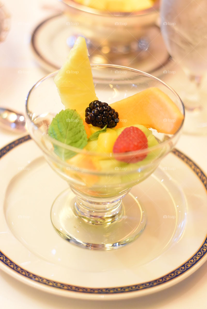 Fresh Fruit cup with Honey-lime dressing.