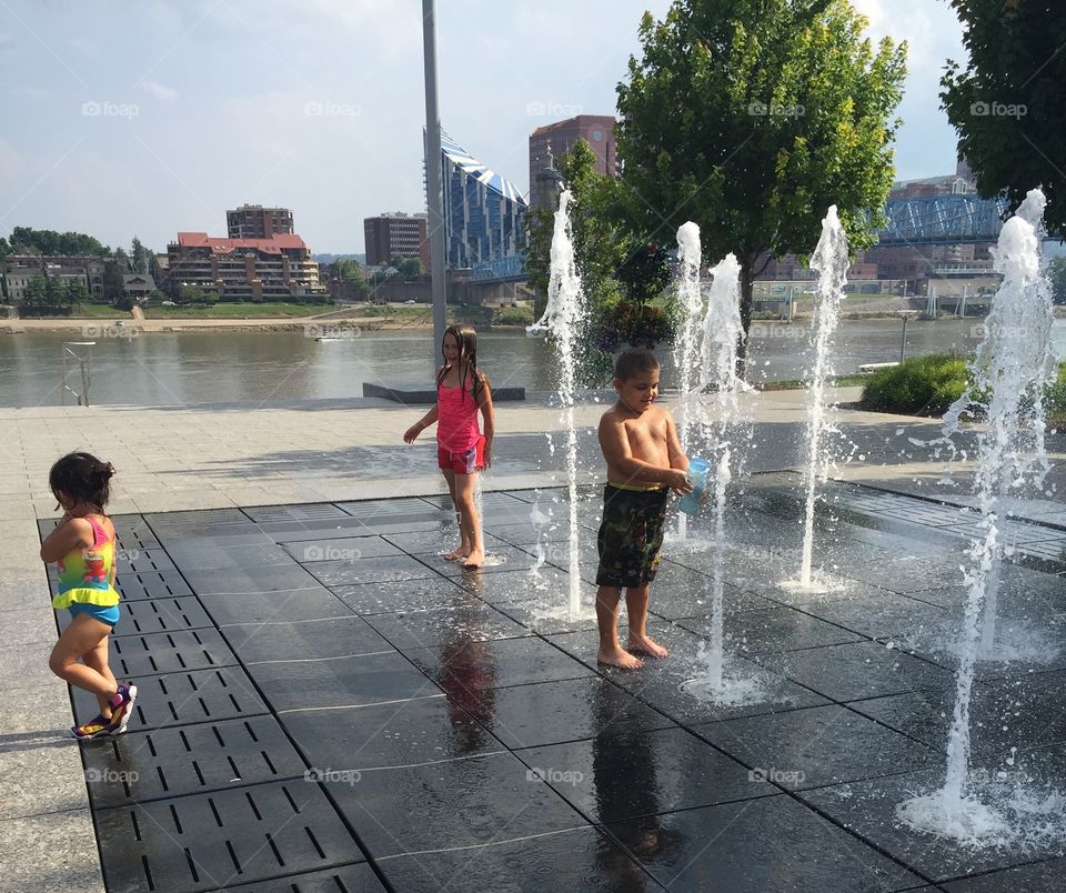 Kids Playing in Fountain