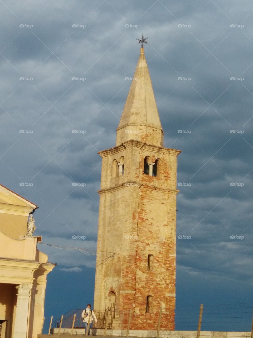 a particular view of madonna dell angelo church lighthouse bell tower in caorle venice italy
