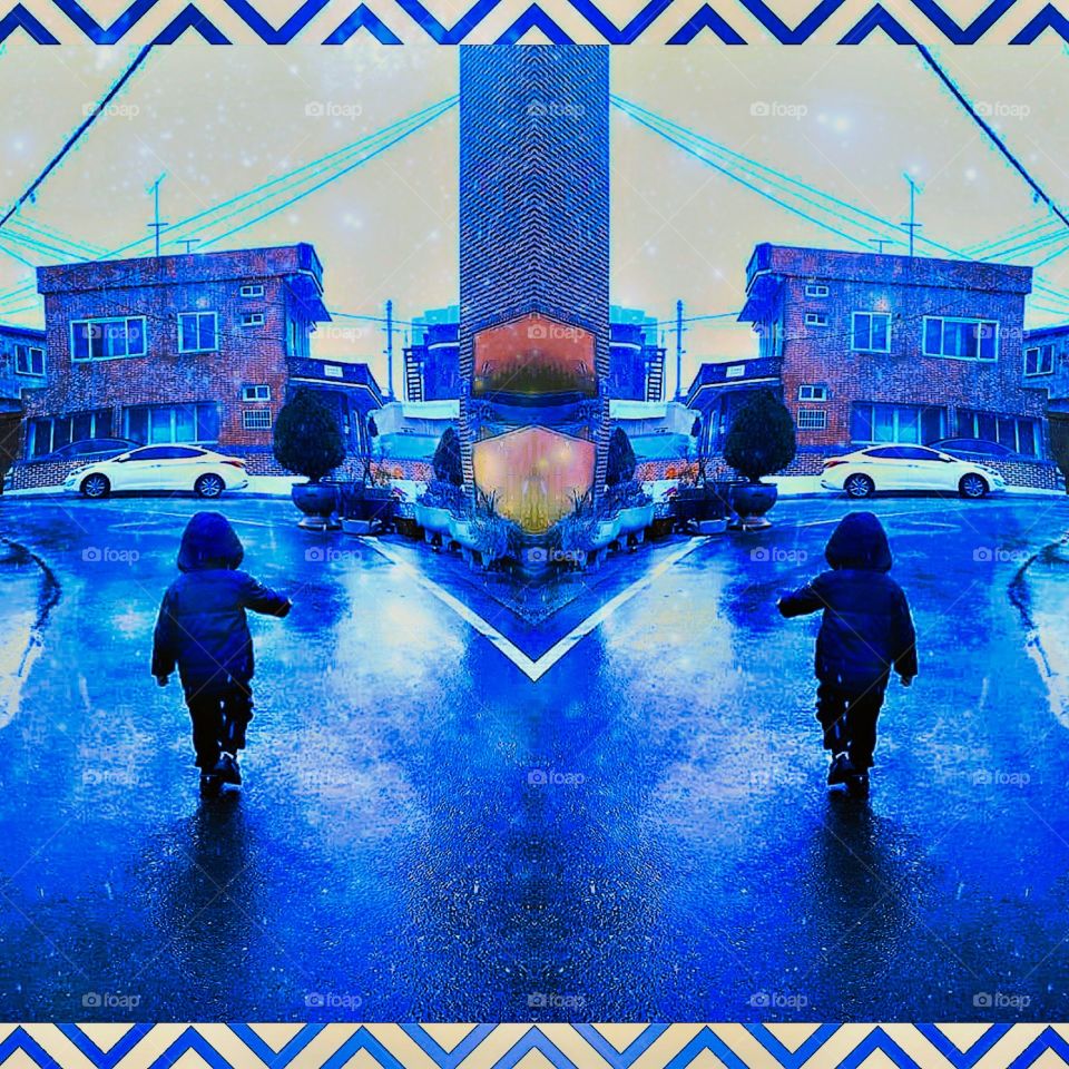 Its the First snow of Winter.
The little boy is walking on the road.
Its seldom for him to see a Snow.
So, Even the snow is just like a rain drops that's falling from above.
For him, its the most memorable and
the Best time ever.