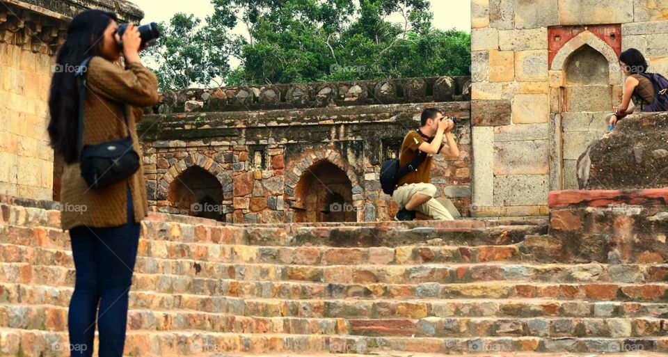 three persons are clicking. Third person is invisible :)