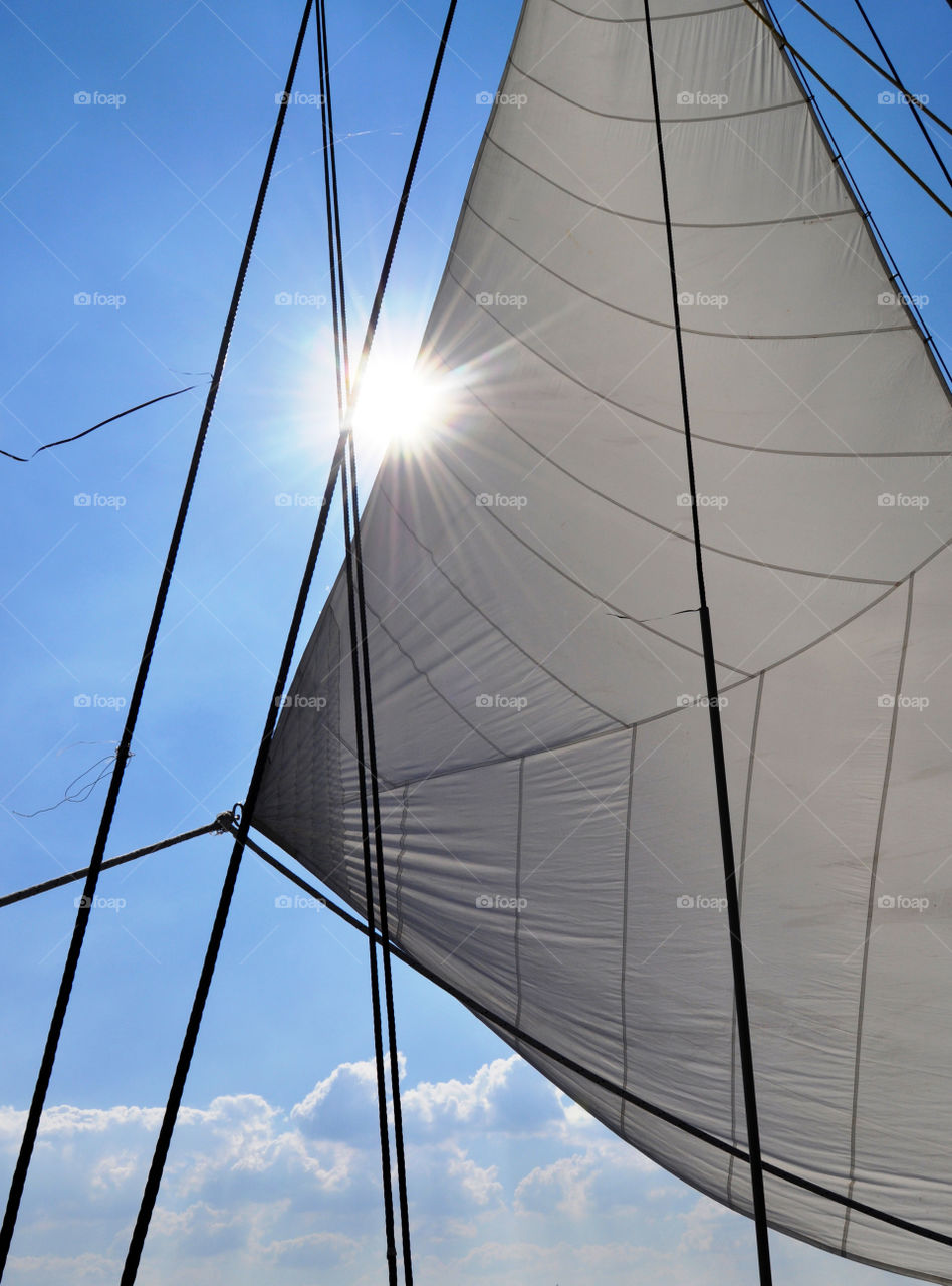 Sun behind the sail 