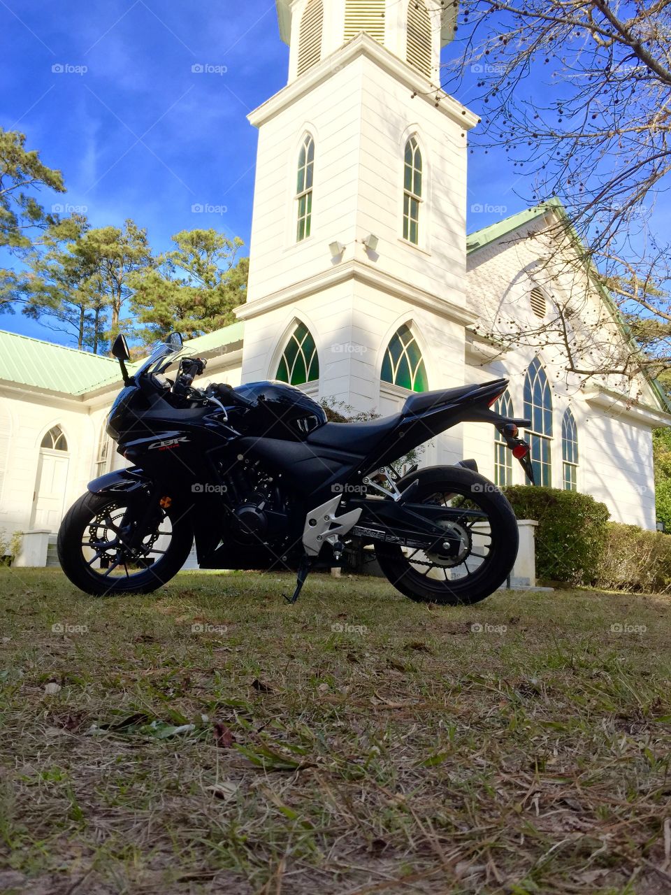 Honda CBR 500. Motorcycle parked in front of a church 