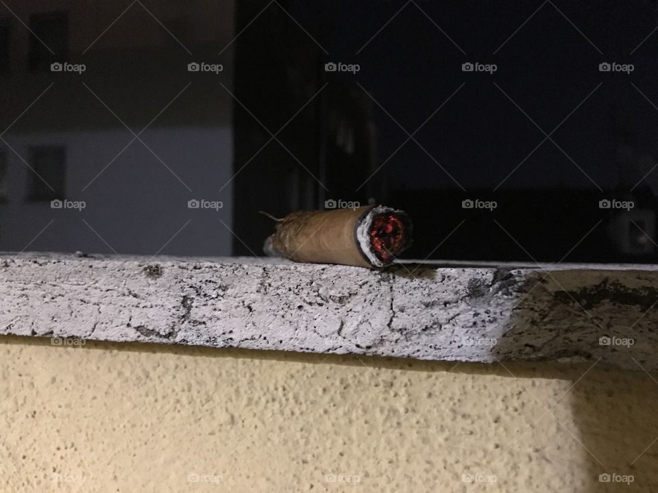 Cigar on rooftop terrace.
