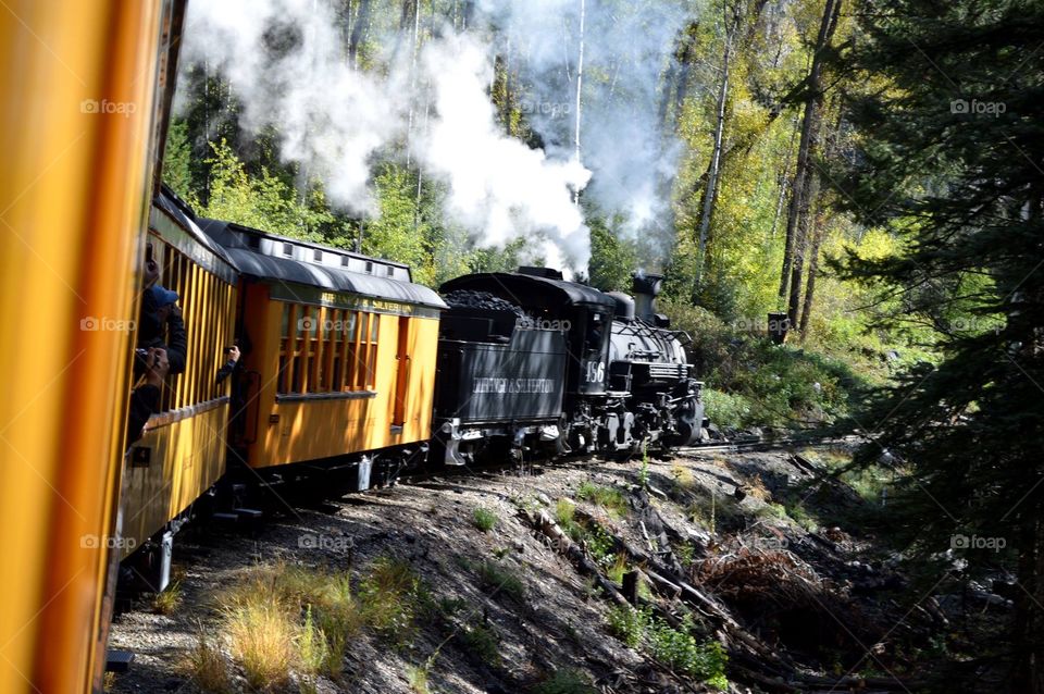 The Durango & Silverton Narrow Gauge Railroad line was built in 1881 and 1882. A historic coal-fired steam engine hauls passengers between the two cities.  silver and gold ore from the San Juan Mountains. In this photo, you can see the coal car. 