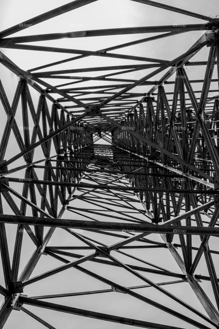 A view towards the top of an electricity tower.