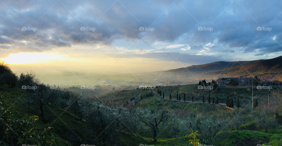 Evening sun in Cortona, Italy. Beautiful valley view from the hilltop city. 