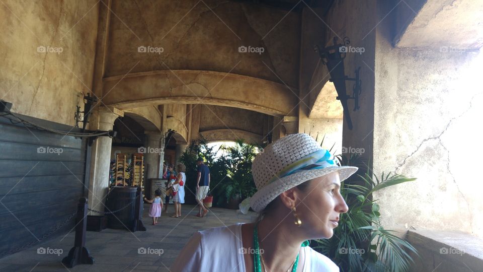 Close-up of female tourist wearing hat