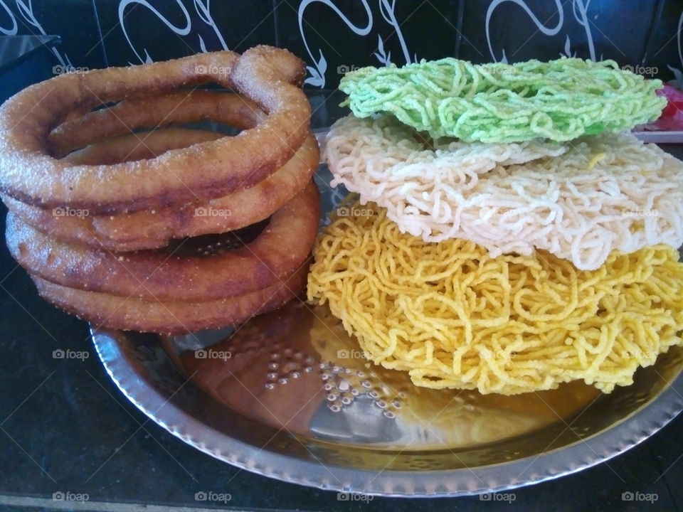 Nepalese traditional homemade sweet, ring bread food selroti and jhilinga. Nepali bread or sel roti is sweet bread made with rice which are popular specially during festivals.
