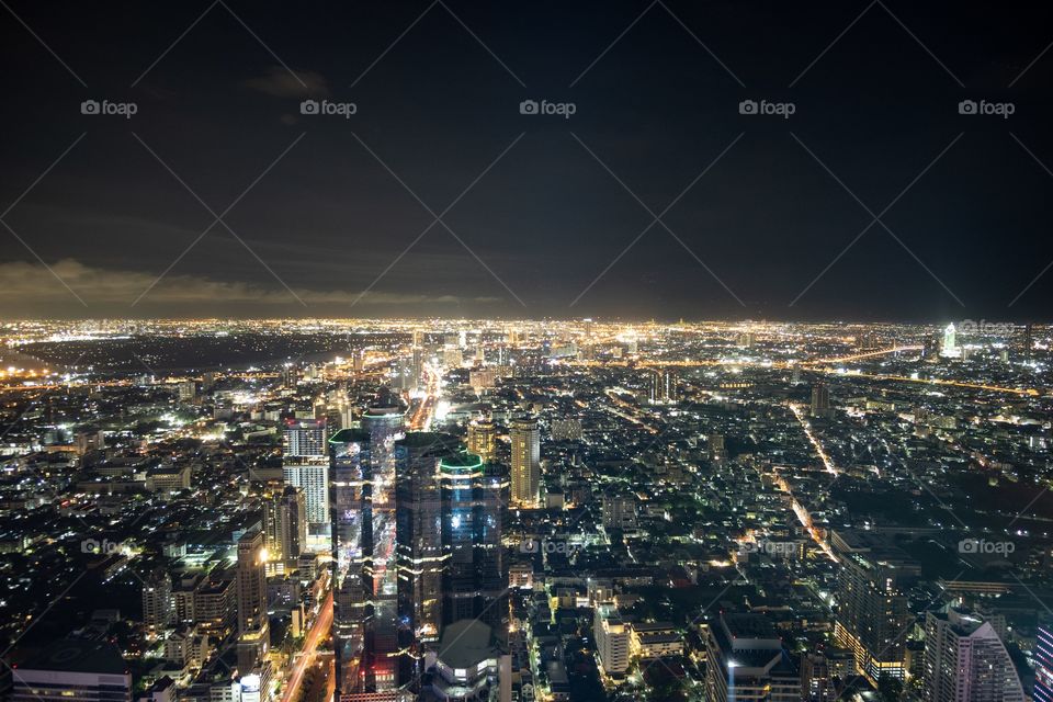 Night view of big city , Bangkok Thailand from king power mahanakhon roof top skywalk , a new traveling place for photography