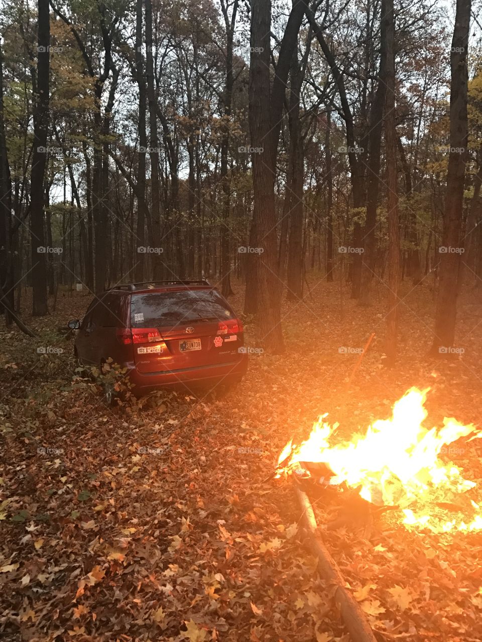 off-roading minivan with fire