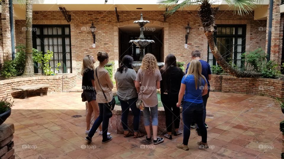 Caught this when we were in the courtyard of Escape the Room in Houston, Texas. A group of youth friends gathered around a water fountain.