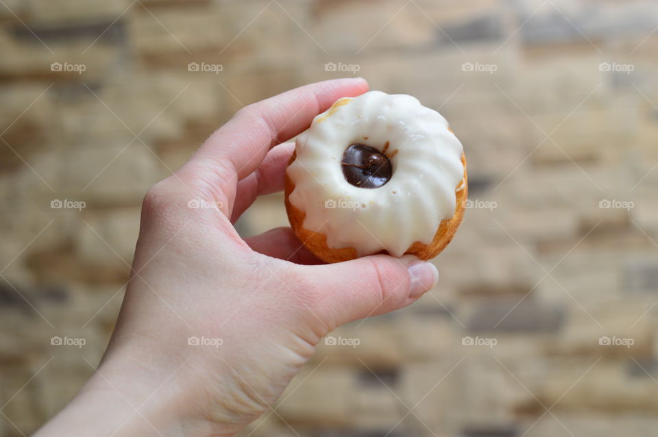 Person holding sweet food