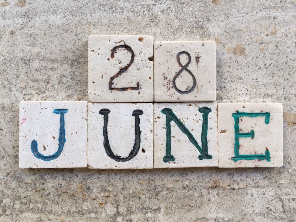 28th June, calendar date. Composition with carved travertine pieces of 28th June, calendar date