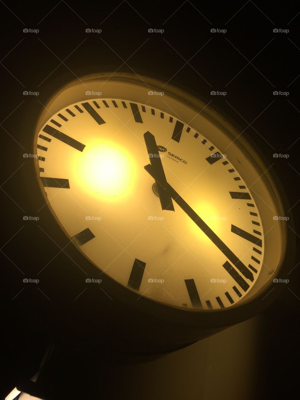 Lighted clock at night