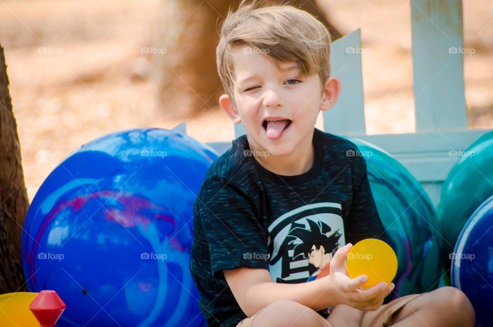 beautiful child tongue out