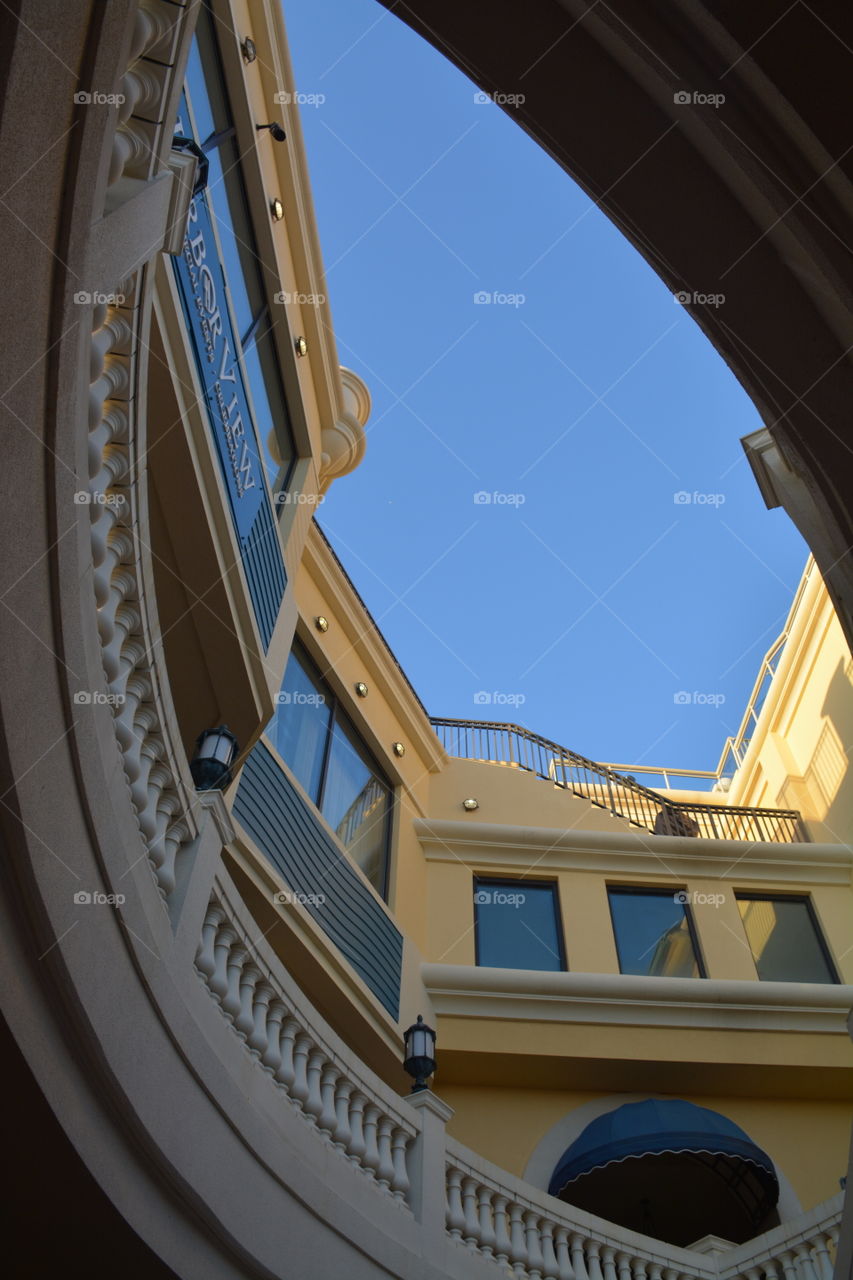 View of the sky and architectural pattern from below the plaza hotel!