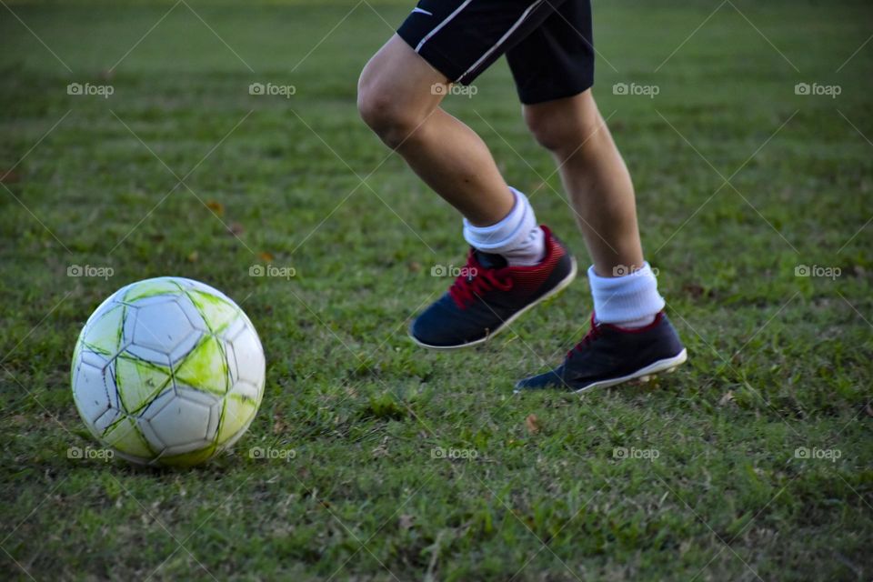 boy playing soccer