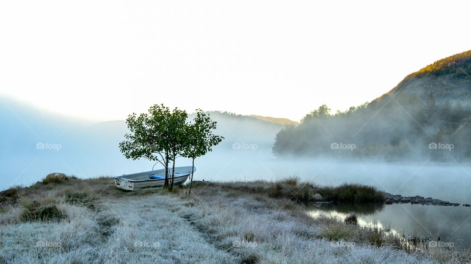 Boat near fog at lake