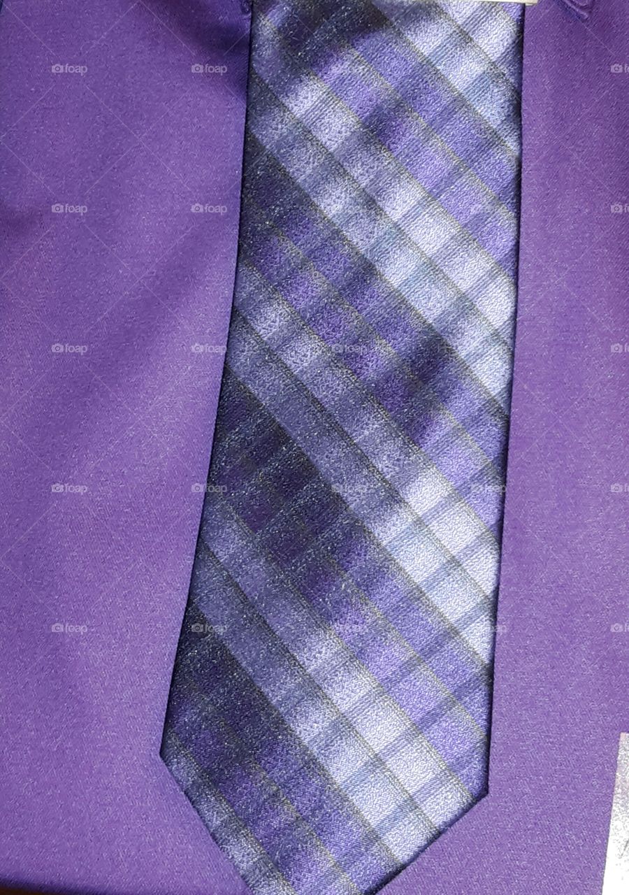 purple shirt and tie
