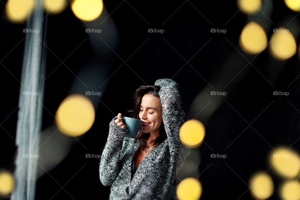 festive morning. girl drinks coffee