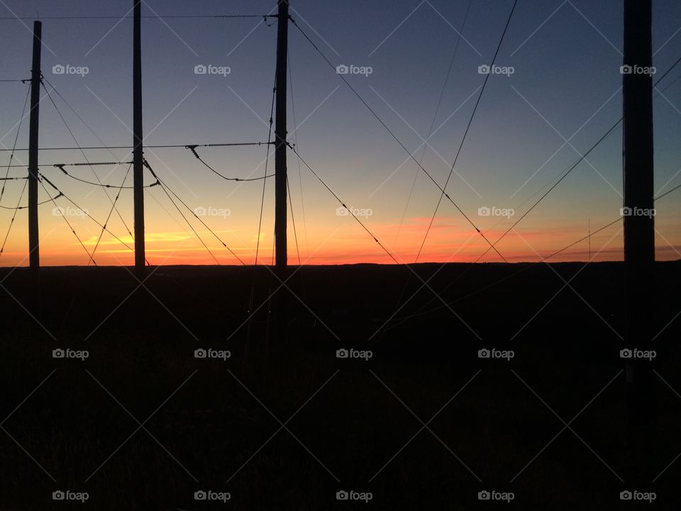 Sunset behind powerlined