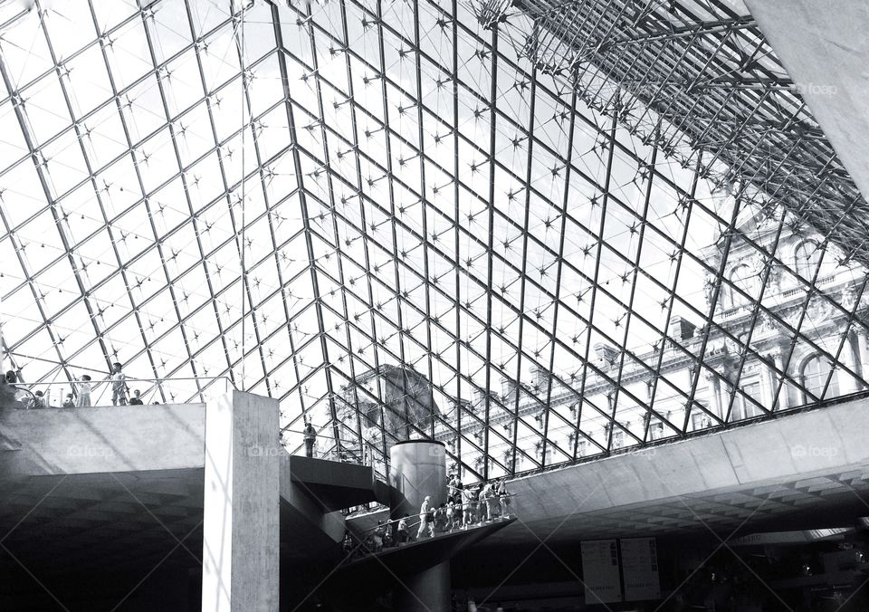 under the Louvre museum . under the pyramid of Louvre museum black and white 